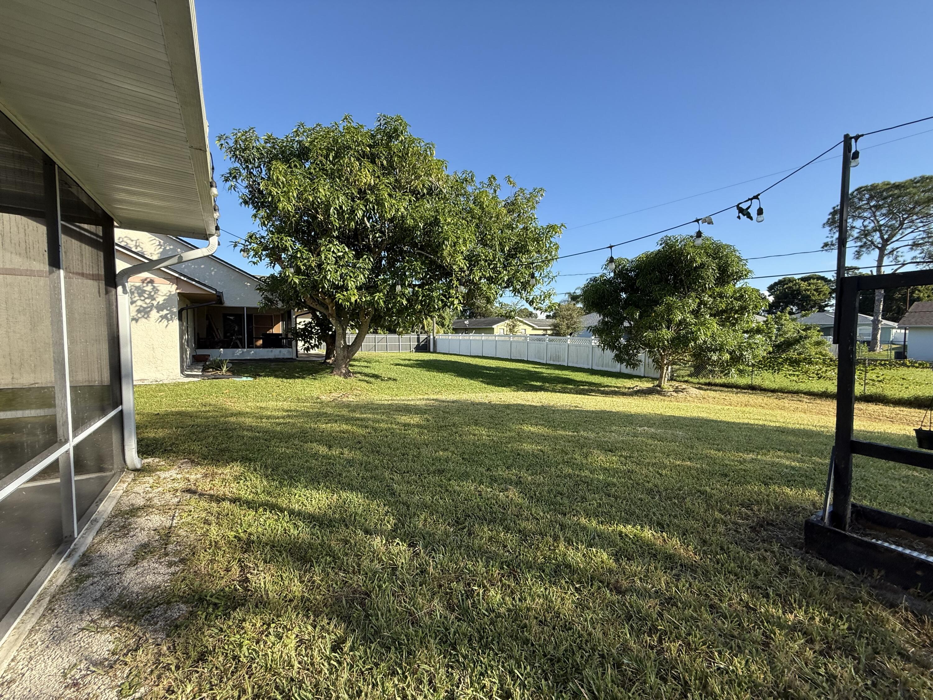 1925 Southwest Libra Lane Port St. Lucie, FL 34984 - Photo 26 of 49 a view of a yard with an outdoor space