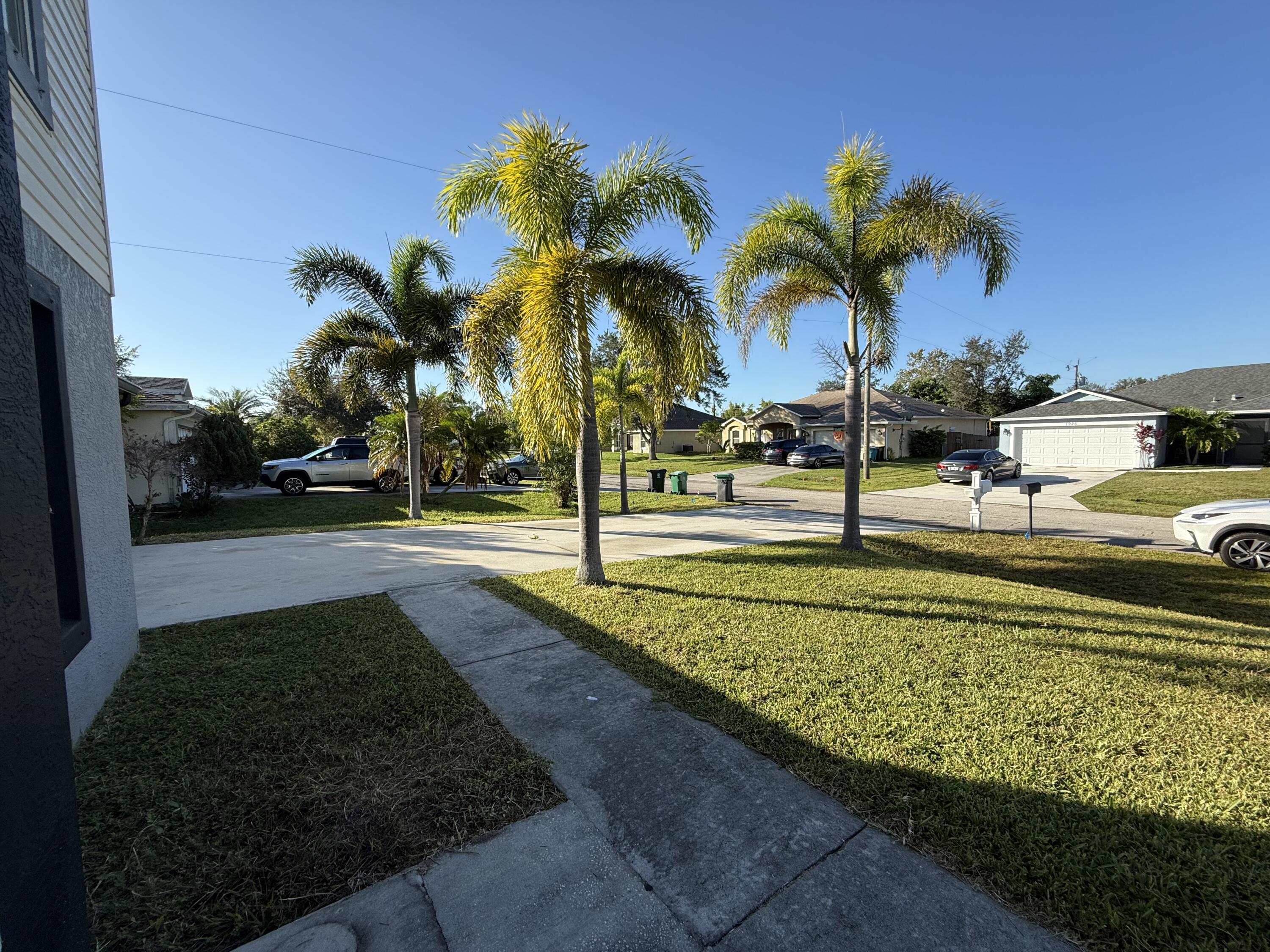 1925 Southwest Libra Lane Port St. Lucie, FL 34984 - Photo 3 of 49 a view of a park with palm trees