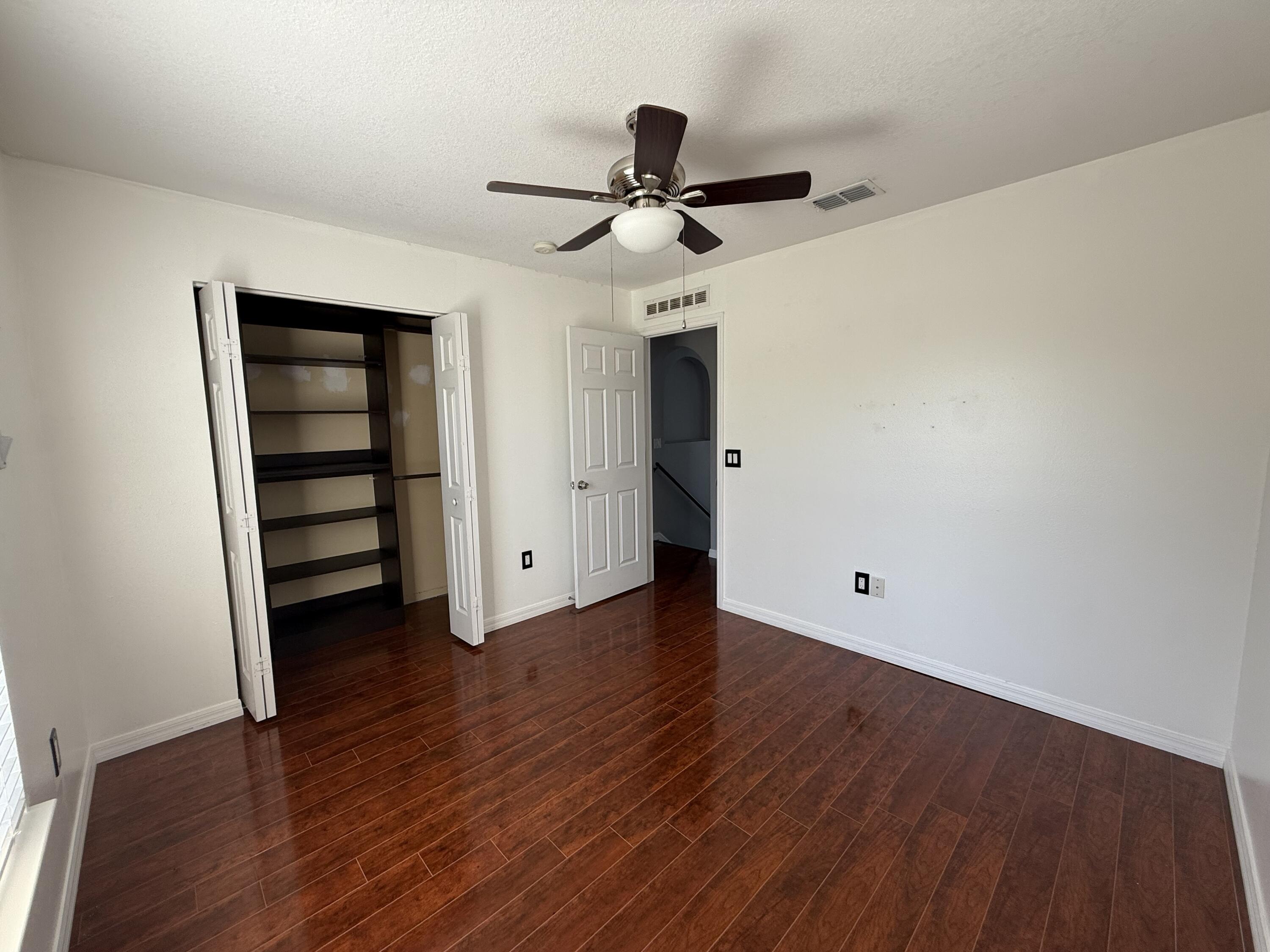 1925 Southwest Libra Lane Port St. Lucie, FL 34984 - Photo 35 of 49 a view of empty room with wooden floor