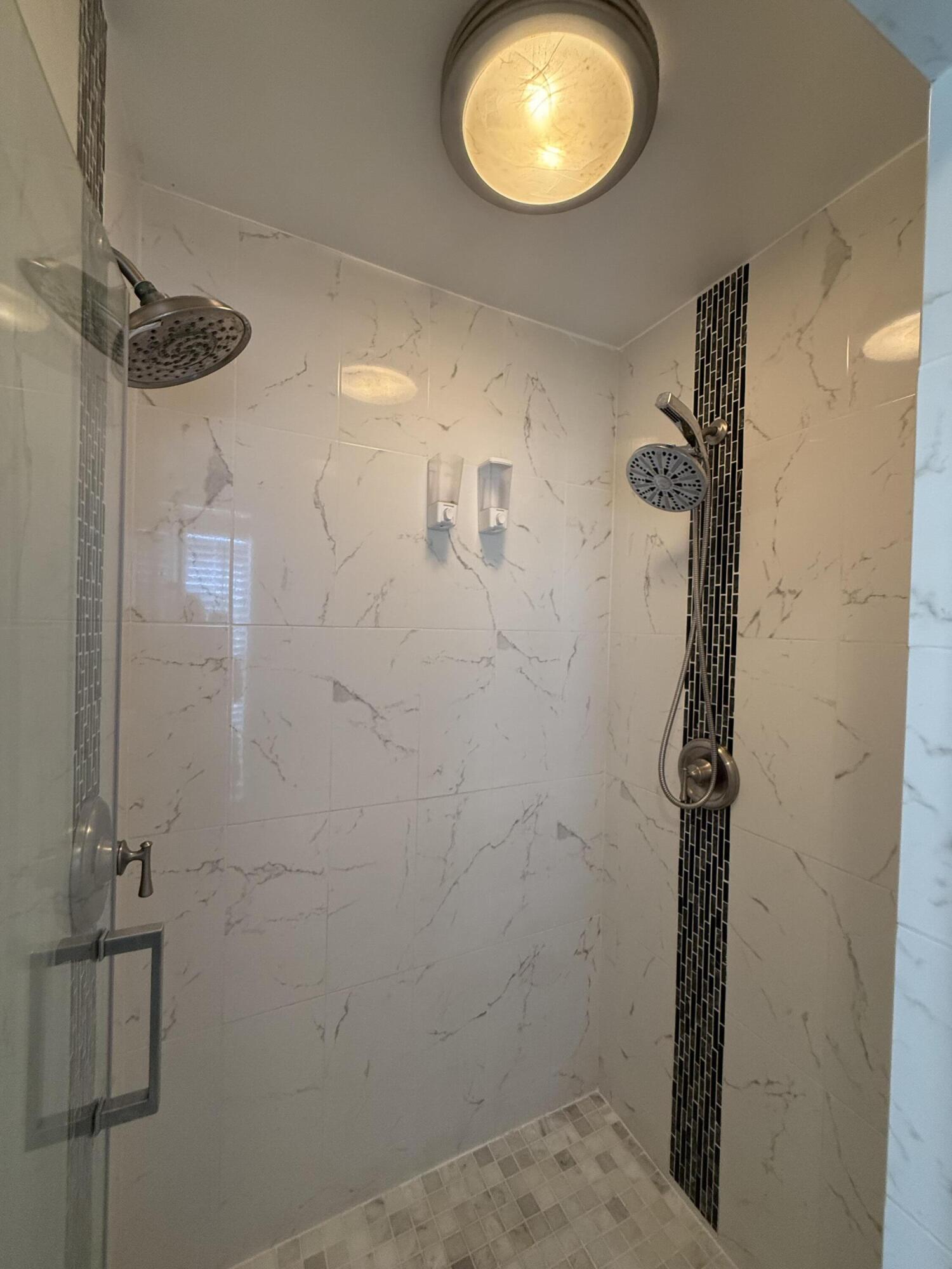 1925 Southwest Libra Lane Port St. Lucie, FL 34984 - Photo 40 of 49 a bathroom with a mirror