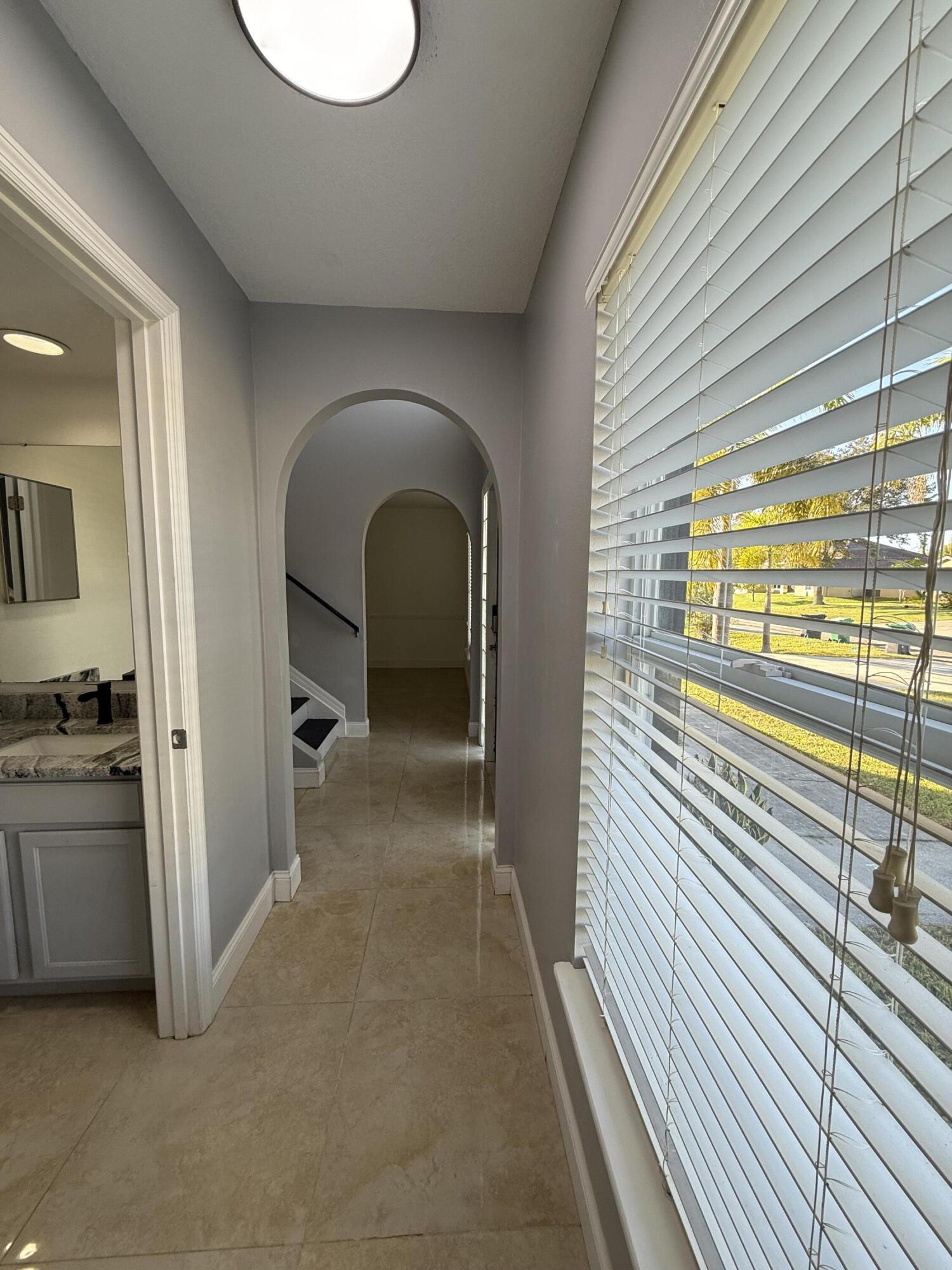 1925 Southwest Libra Lane Port St. Lucie, FL 34984 - Photo 8 of 49 a view of a bathroom with a bathtub