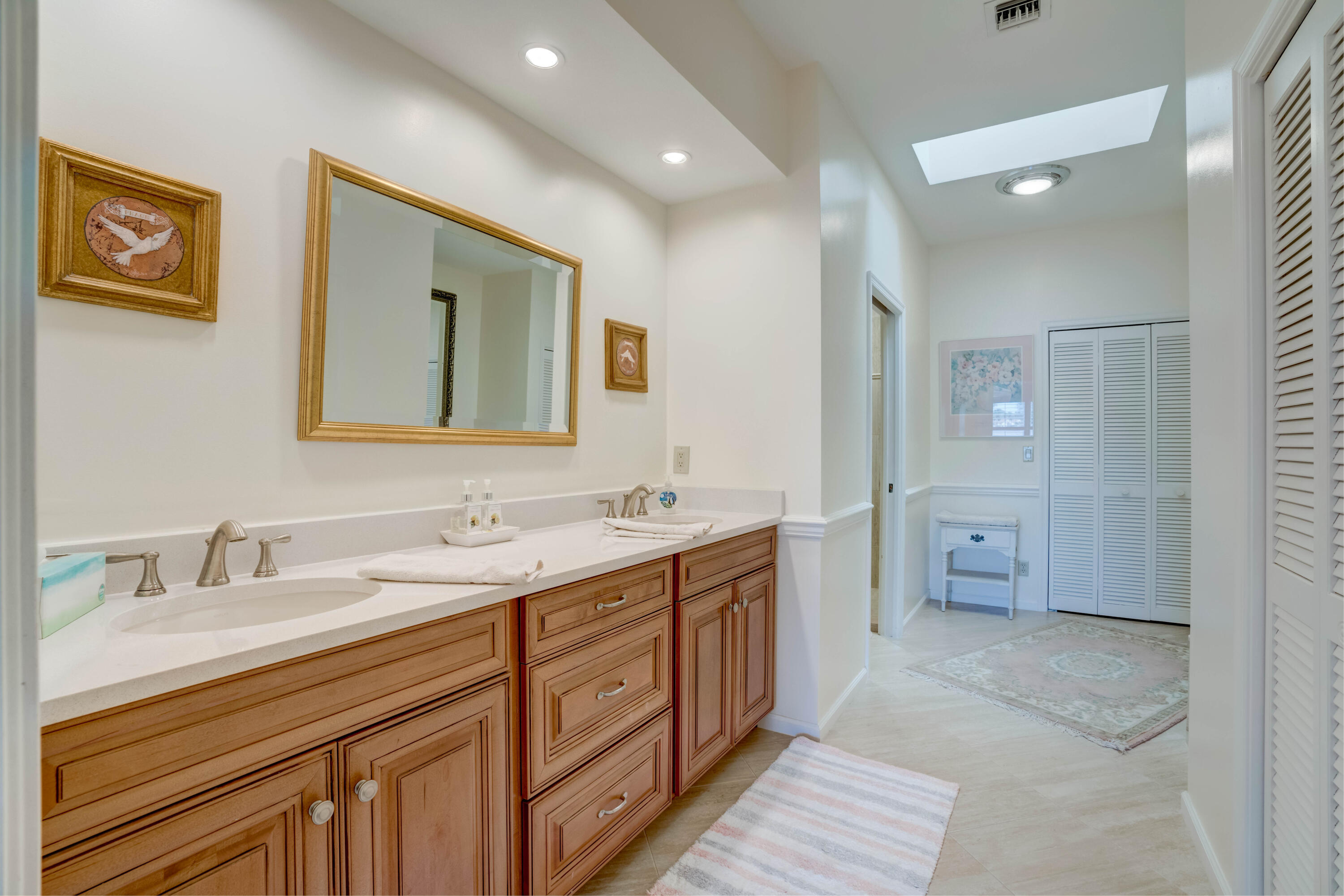 3518 Lantern Bay Drive Jupiter, FL 33477 - Photo 19 of 32 a spacious bathroom with a double vanity sink mirror and shower