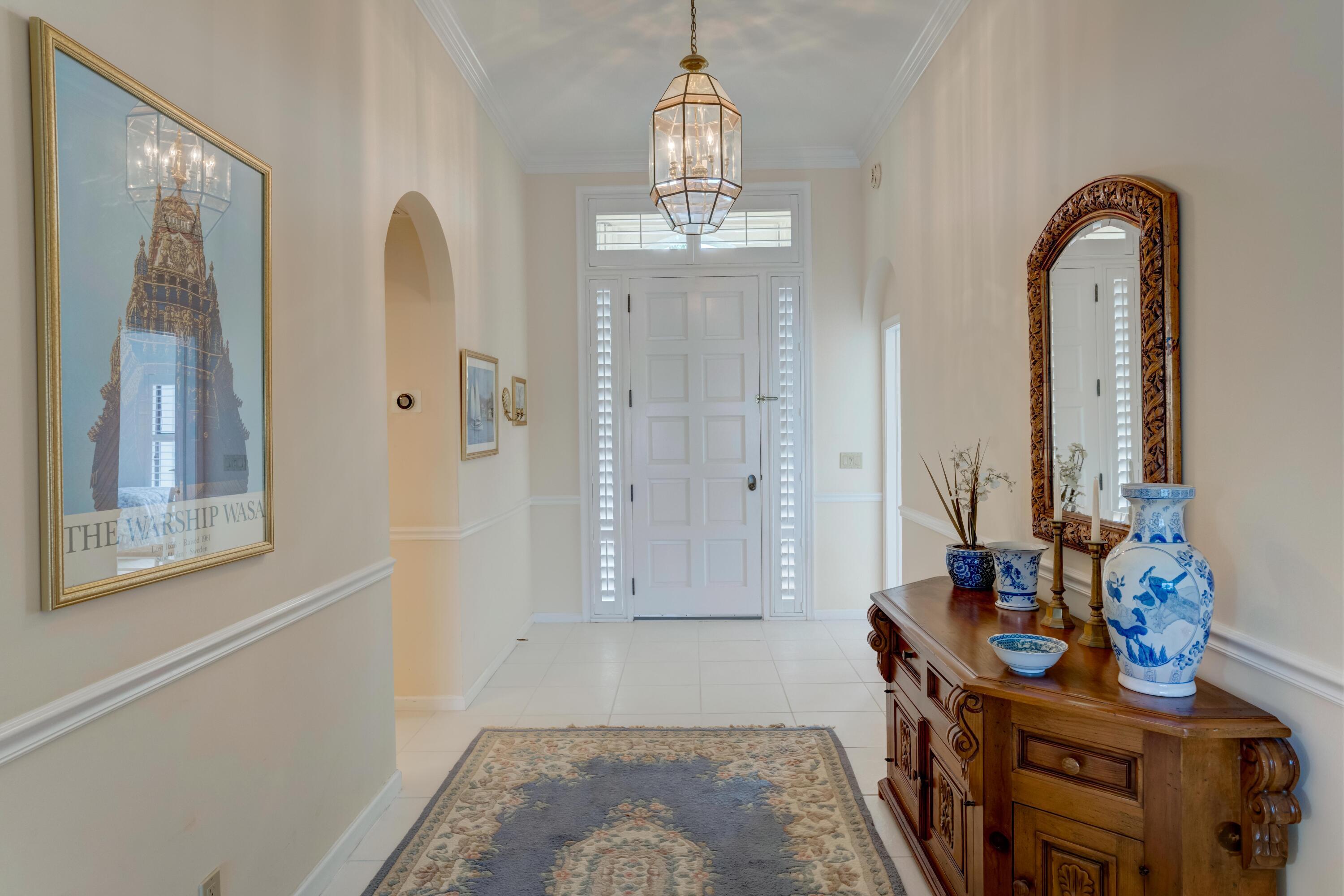 3518 Lantern Bay Drive Jupiter, FL 33477 - Photo 2 of 32 a view of an entryway with wooden floor