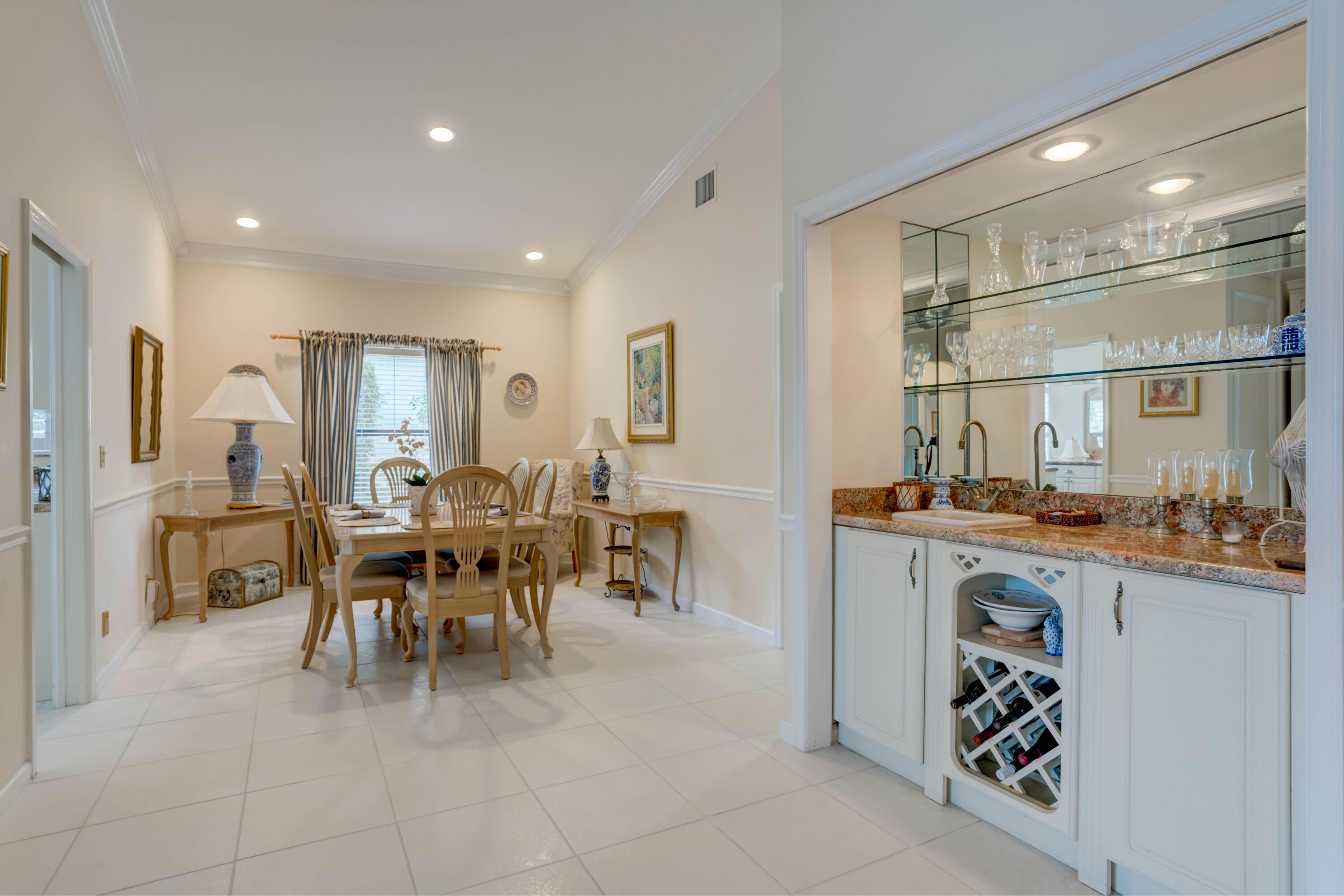 3518 Lantern Bay Drive Jupiter, FL 33477 - Photo 23 of 32 a dining hall with stainless steel appliances a dining table and chairs