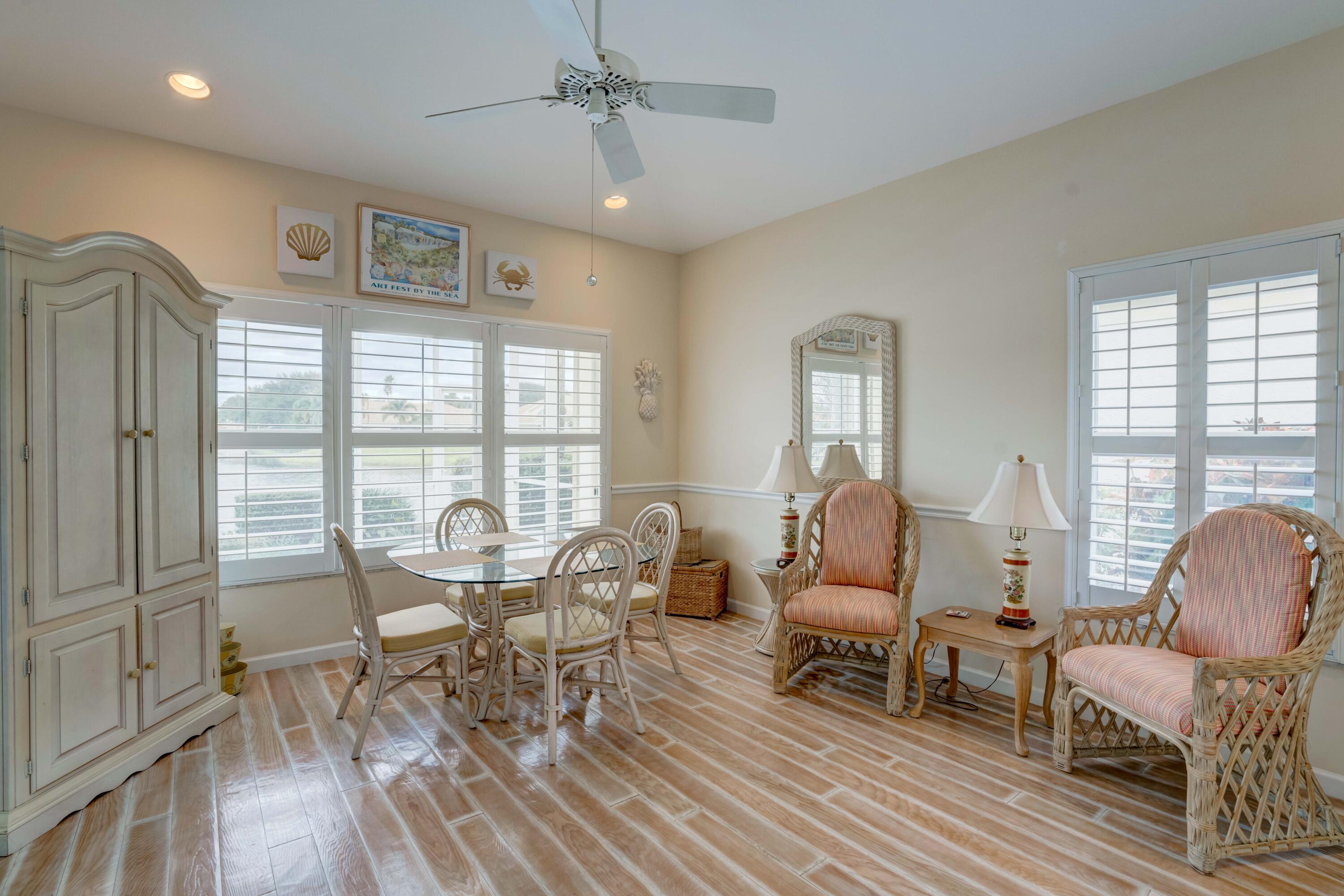 3518 Lantern Bay Drive Jupiter, FL 33477 - Photo 27 of 32 a living room with furniture and a wooden floor