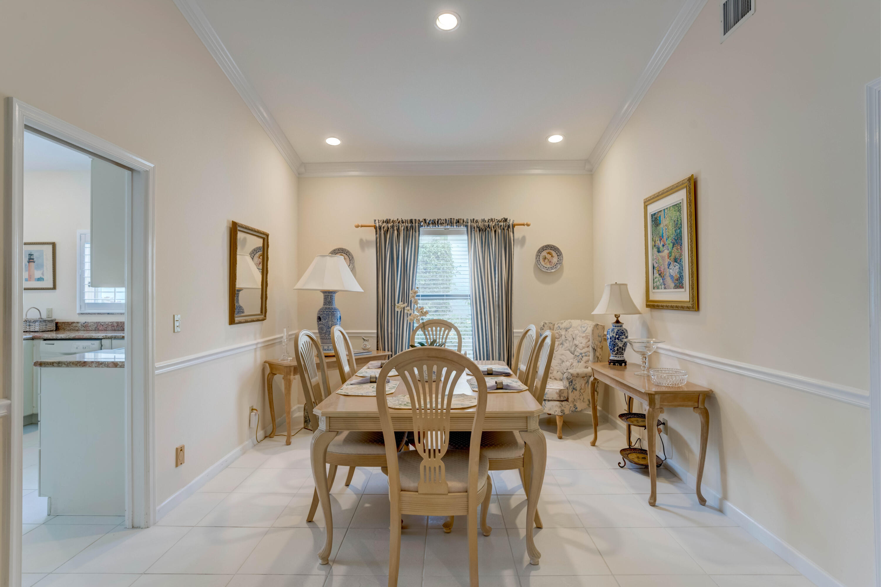 3518 Lantern Bay Drive Jupiter, FL 33477 - Photo 6 of 32 a view of a dining room with furniture and chandelier