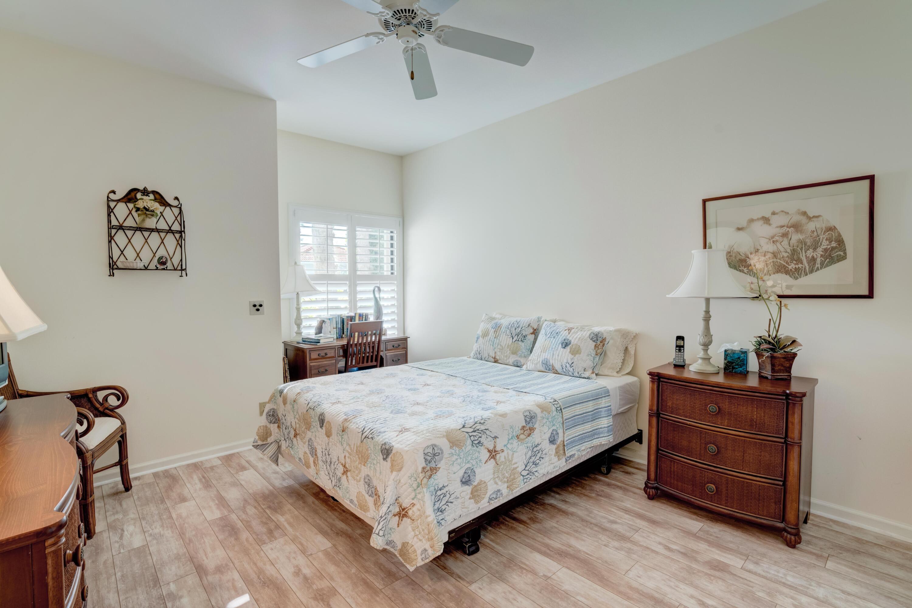 3518 Lantern Bay Drive Jupiter, FL 33477 - Photo 10 of 32 a bedroom with a bed and a window