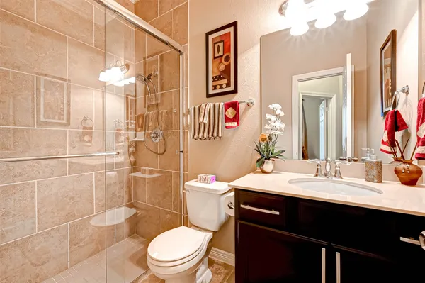 a kitchen with stainless steel appliances granite countertop a sink and a microwave