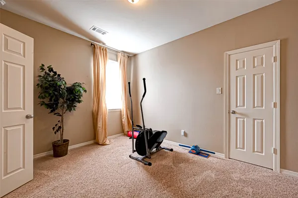 a bath room with a toilet and a shower curtain
