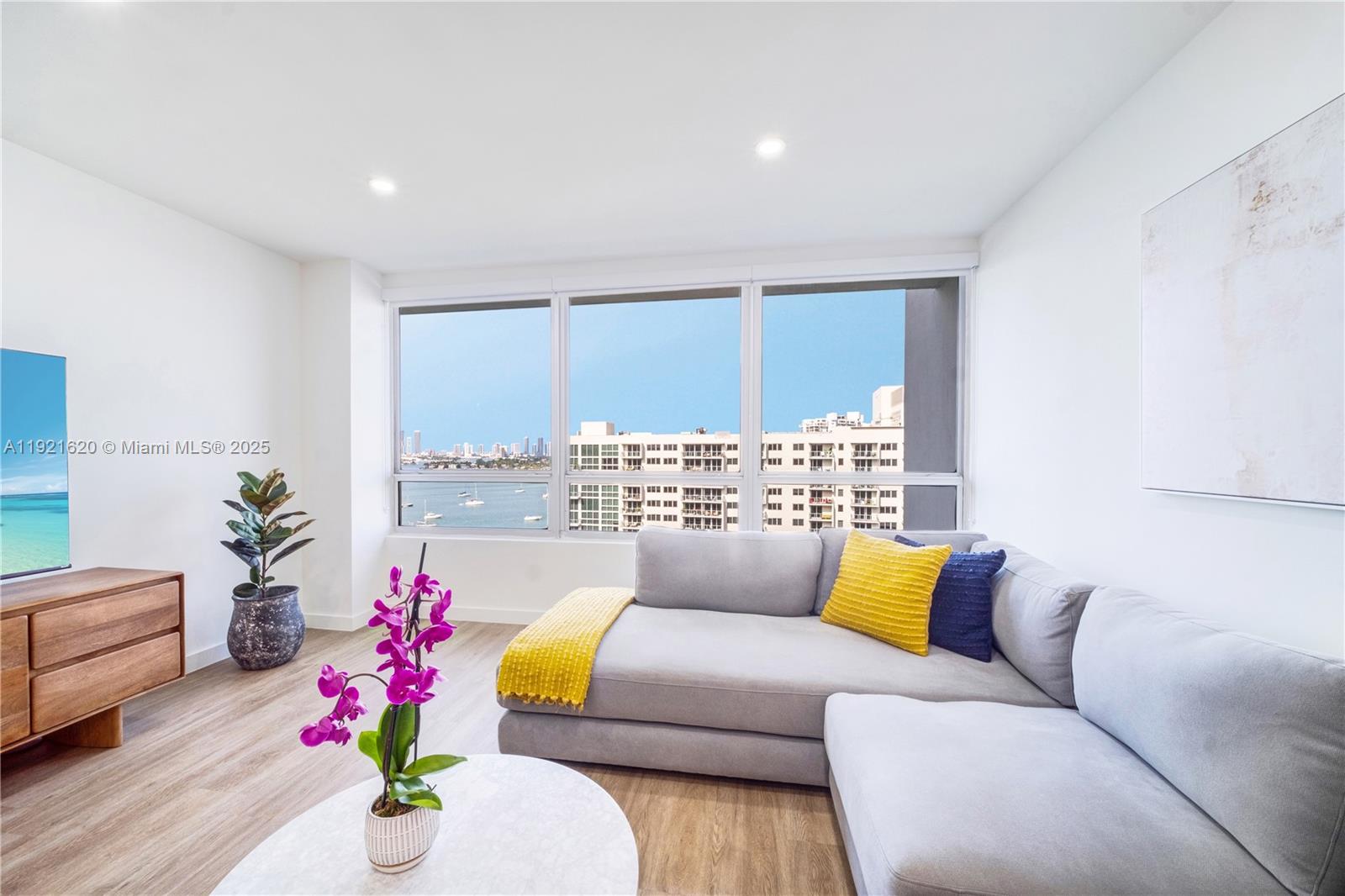1500 Bay Road, Unit 1558S Miami Beach, FL 33139 - Photo 13 of 54 a living room with furniture and a large window