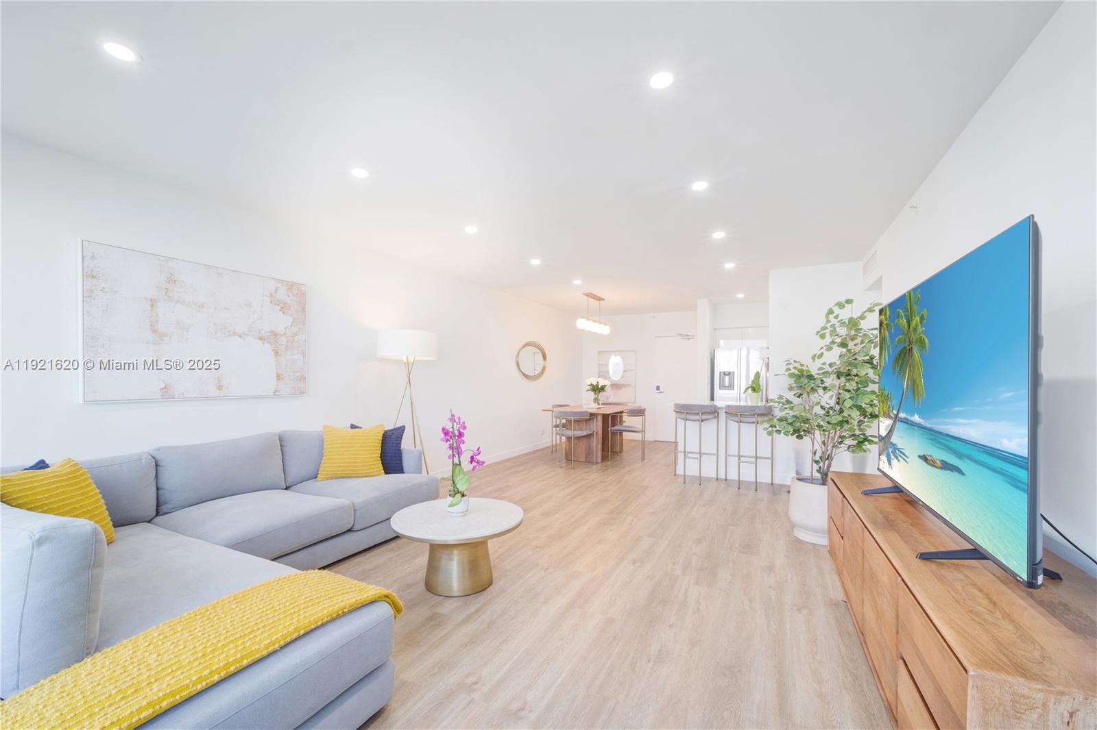 1500 Bay Road, Unit 1558S Miami Beach, FL 33139 - Photo 19 of 54 a living room with furniture and a flat screen tv