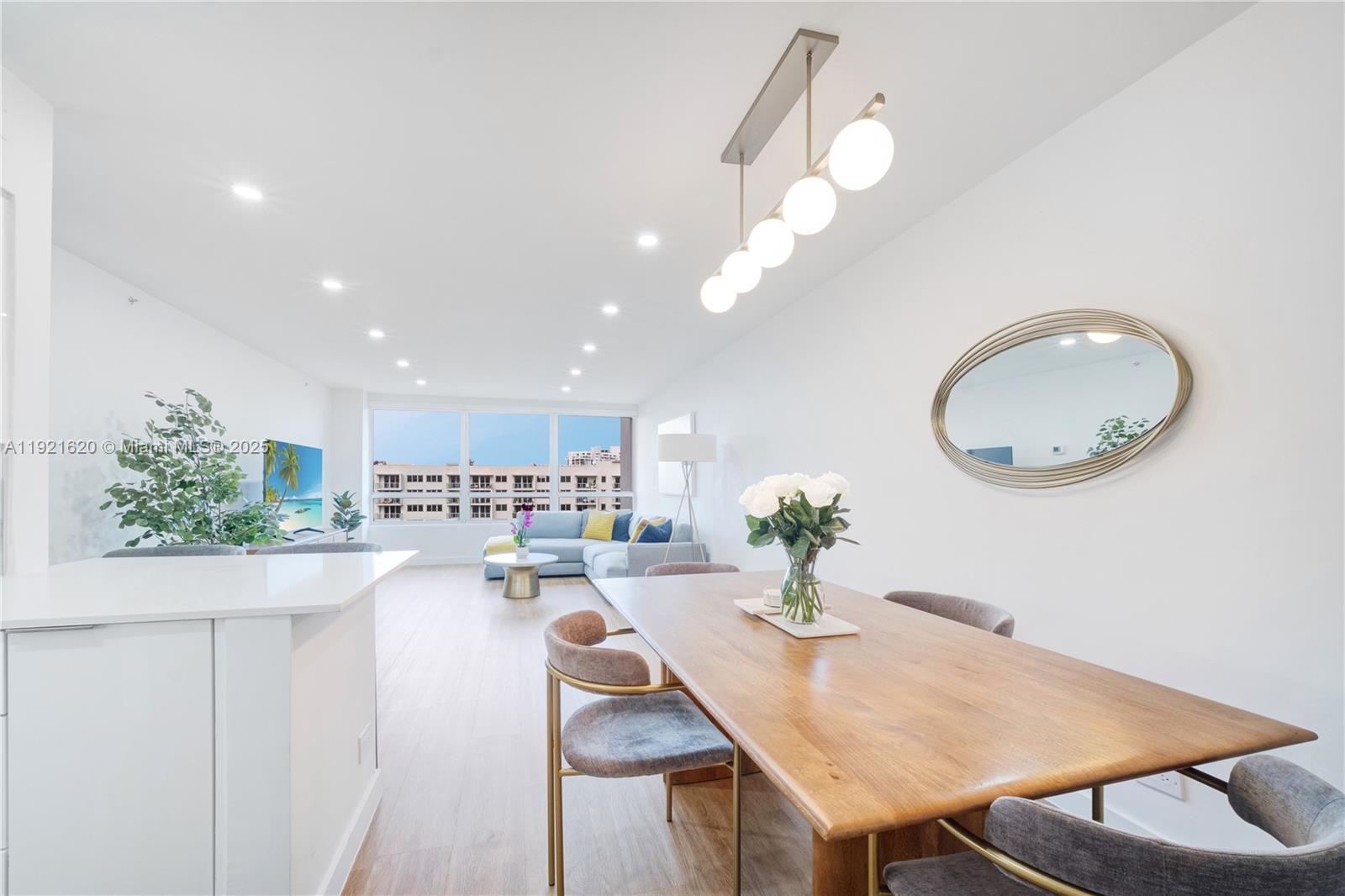 1500 Bay Road, Unit 1558S Miami Beach, FL 33139 - Photo 3 of 54 a kitchen with a table and chairs