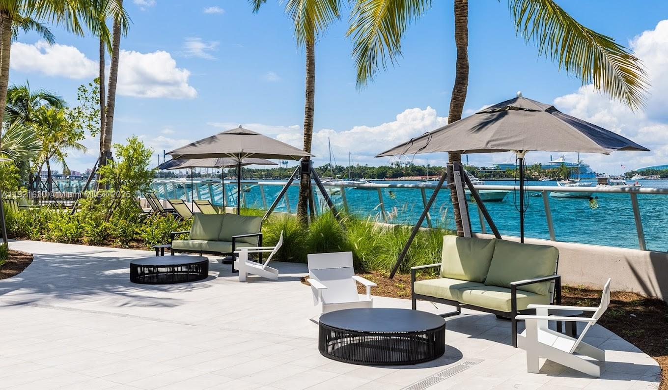 1500 Bay Road, Unit 1558S Miami Beach, FL 33139 - Photo 32 of 54 a view of a chairs and table in the patio