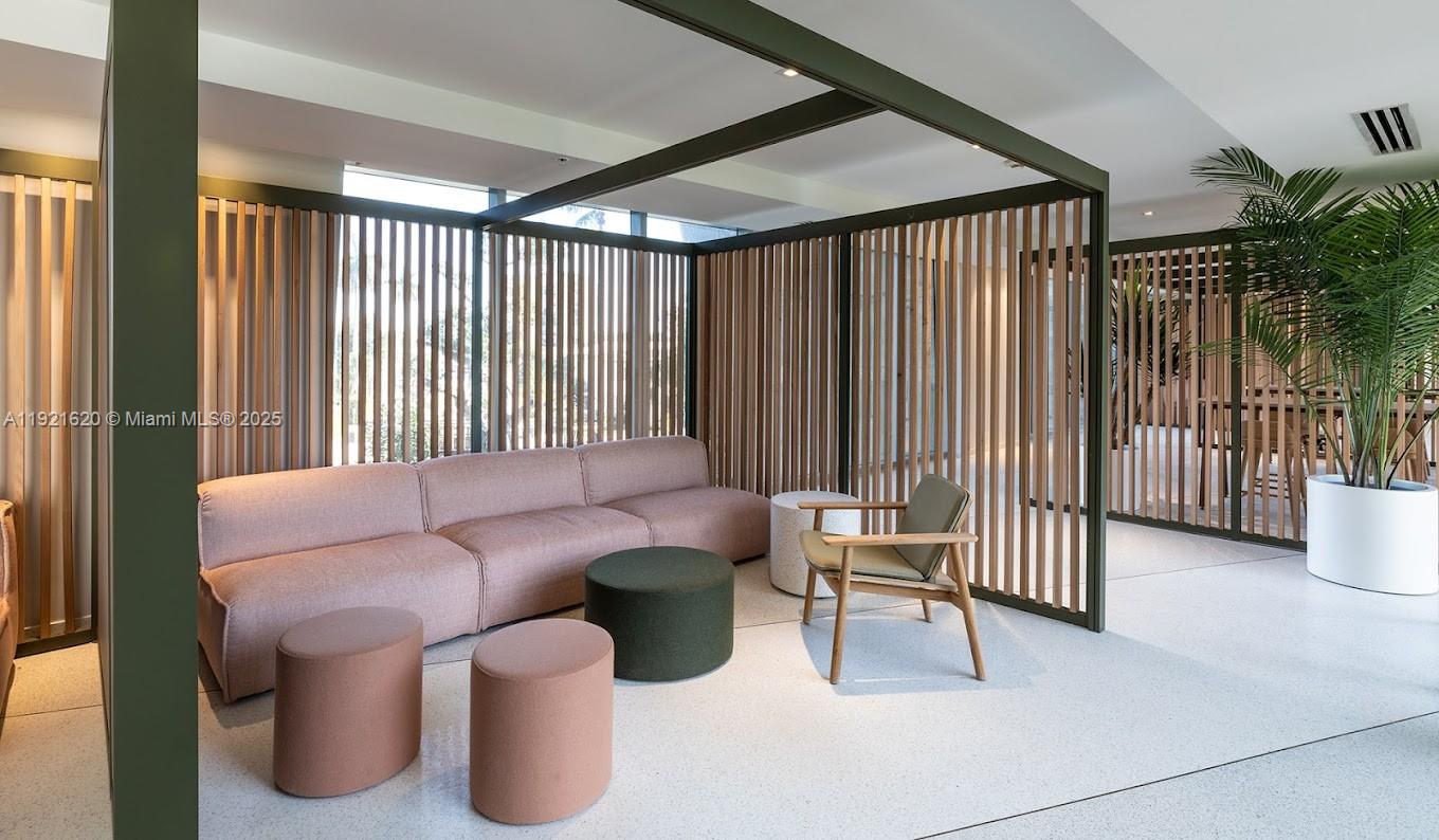 1500 Bay Road, Unit 1558S Miami Beach, FL 33139 - Photo 44 of 54 a living room with furniture and a floor to ceiling window