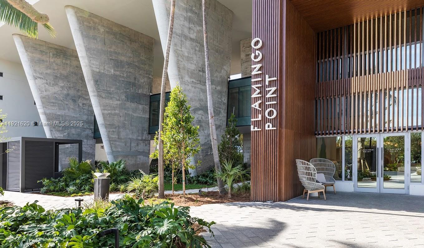 1500 Bay Road, Unit 1558S Miami Beach, FL 33139 - Photo 52 of 54 a building with potted plants in front of it