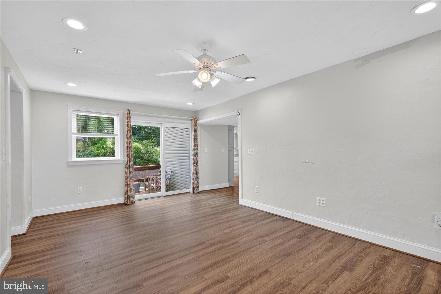 5605 Waltersdorff Road Spring Grove, PA 17362 - Photo 13 of 40 an empty room with wooden floor and windows