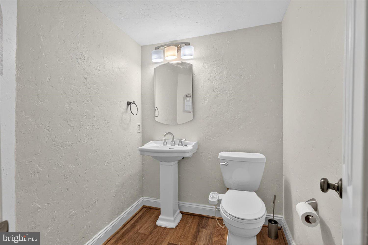 5605 Waltersdorff Road Spring Grove, PA 17362 - Photo 18 of 40 a bathroom with a toilet sink and mirror