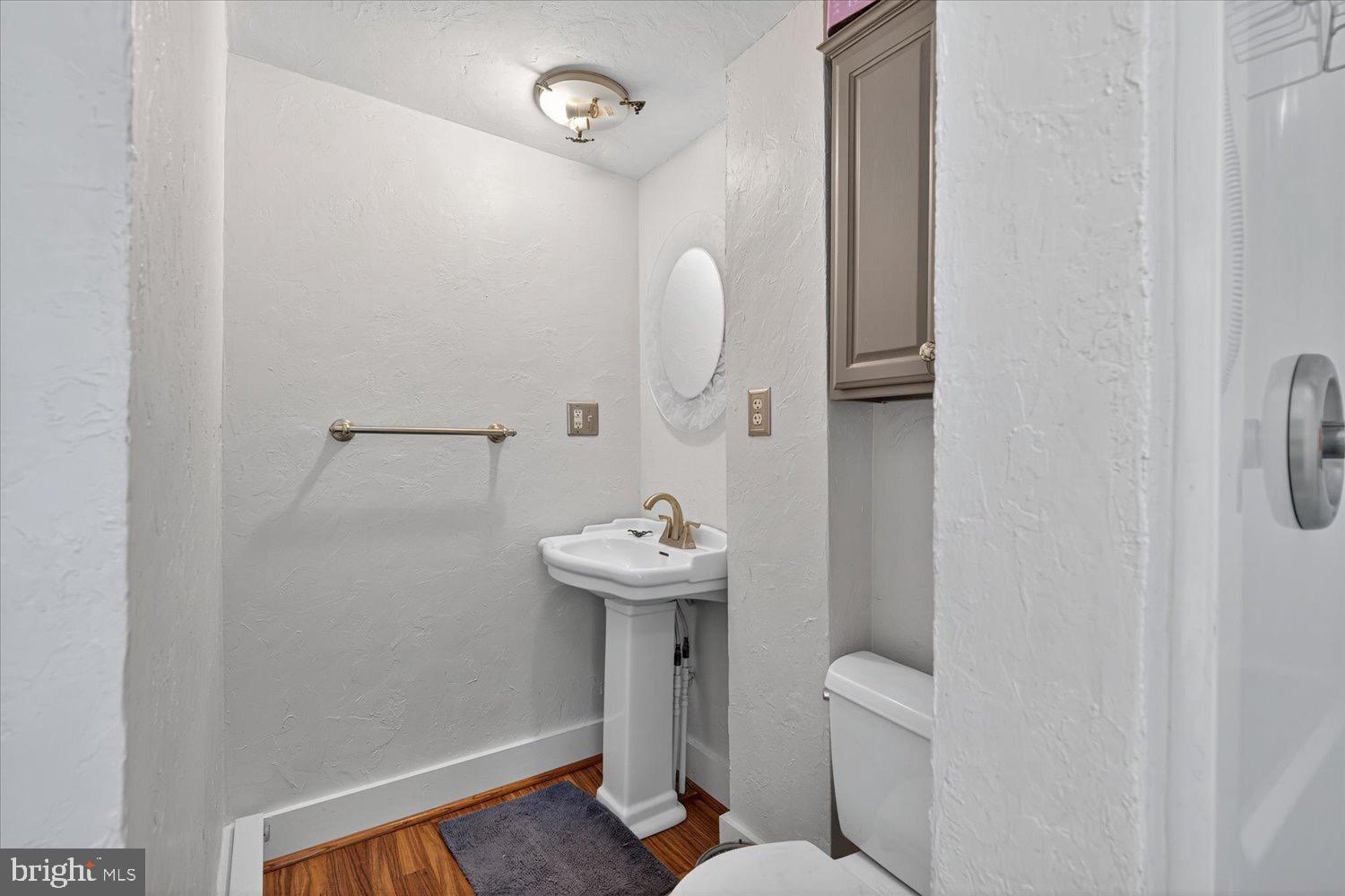 5605 Waltersdorff Road Spring Grove, PA 17362 - Photo 23 of 40 a bathroom with a sink a toilet and a mirror
