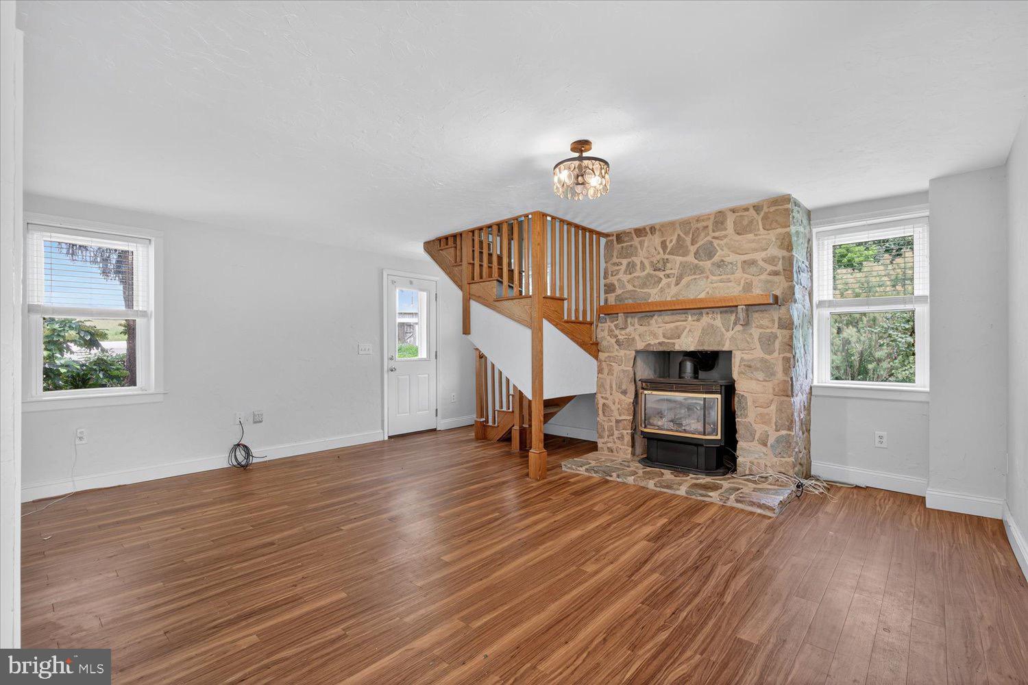 5605 Waltersdorff Road Spring Grove, PA 17362 - Photo 8 of 40 a view of livingroom with furniture wooden floor fireplace and window