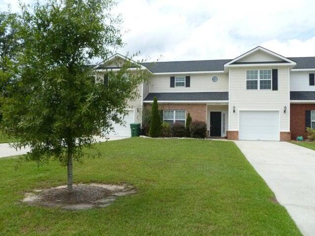 504 Westminster Court Rincon, GA 31326 - Photo 1 of 1 a front view of a house with a yard and trees