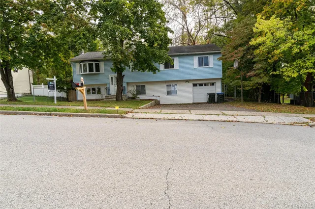 a house with trees in the background