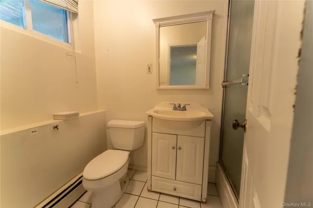 a bathroom with a sink toilet and vanity