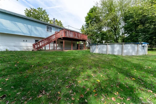 a view of a backyard of the house