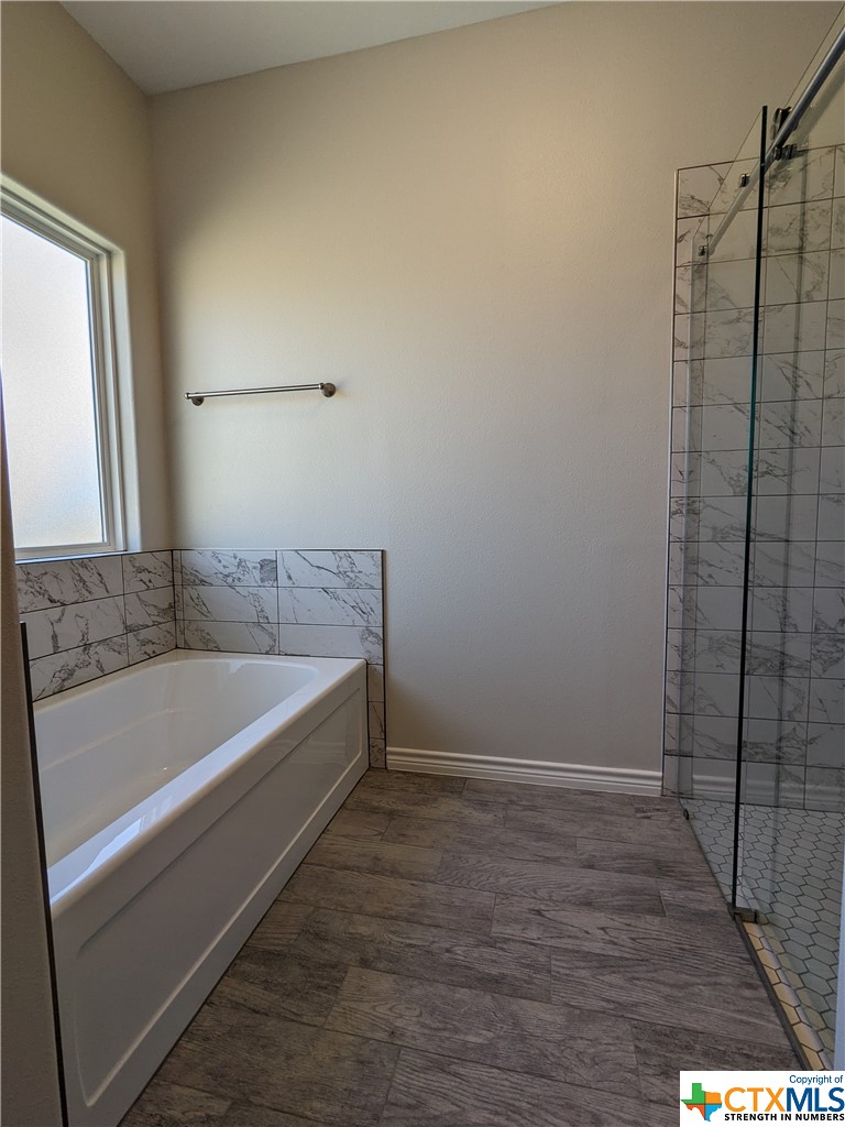 407 Gamel Street Lampasas, TX 76550 - Photo 15 of 20 a bathroom with a bathtub and shower