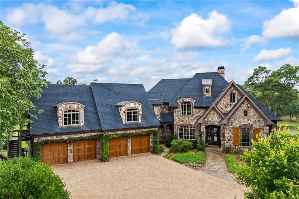 4239 Lower Jersey Road Covington, GA 30014 - Photo 13 of 91 a front view of a house with garden