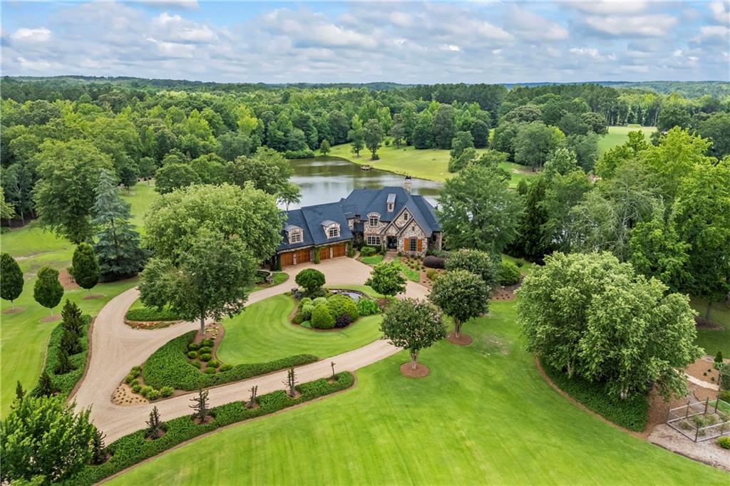 4239 Lower Jersey Road Covington, GA 30014 - Photo 14 of 91 an aerial view of a house with a yard and outdoor seating