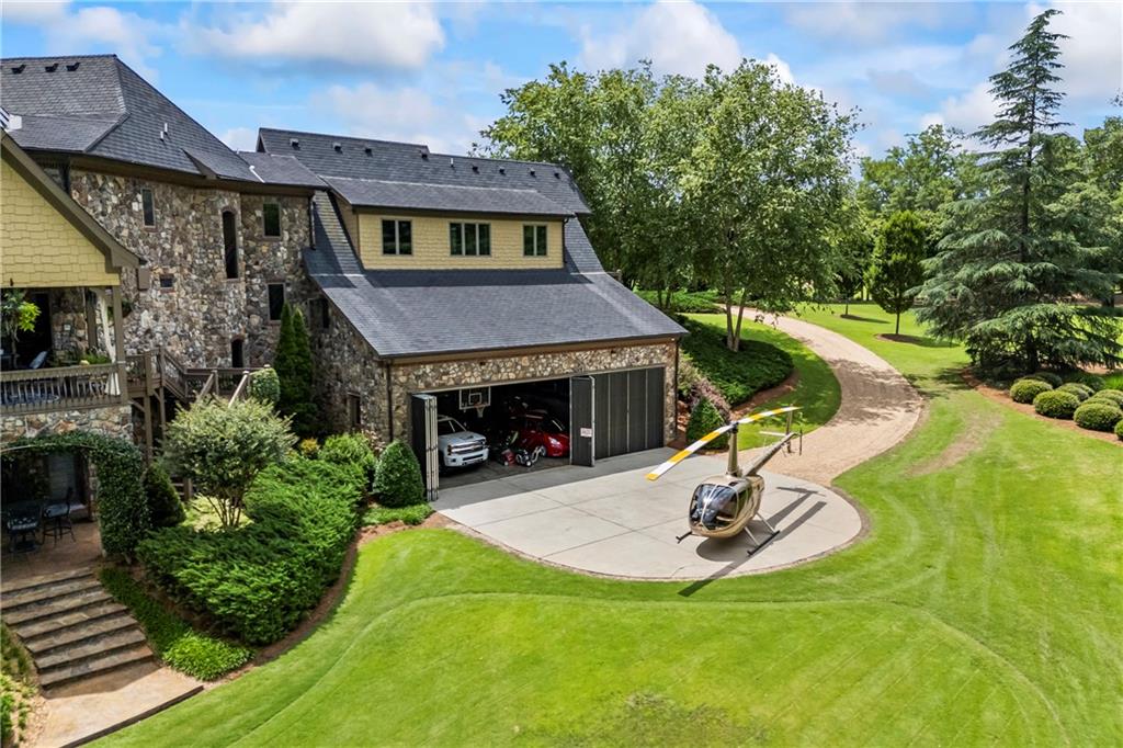 4239 Lower Jersey Road Covington, GA 30014 - Photo 15 of 91 a view of a house with a yard patio and fire pit
