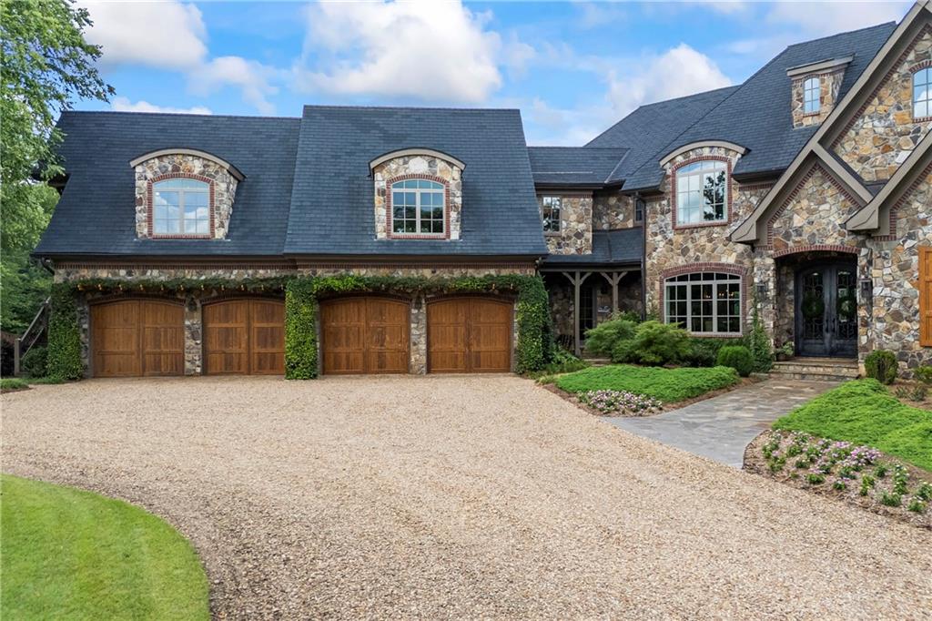 4239 Lower Jersey Road Covington, GA 30014 - Photo 16 of 91 a front view of a house with a garden