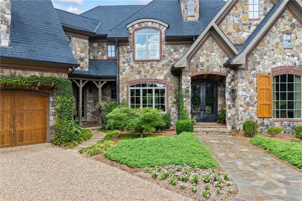 4239 Lower Jersey Road Covington, GA 30014 - Photo 17 of 91 a front view of a house with garden