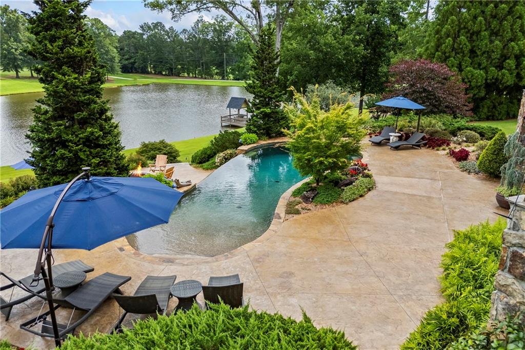 4239 Lower Jersey Road Covington, GA 30014 - Photo 20 of 91 an aerial view of a house with a yard and lake view