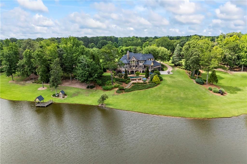 4239 Lower Jersey Road Covington, GA 30014 - Photo 21 of 91 a view of a swimming pool with a yard