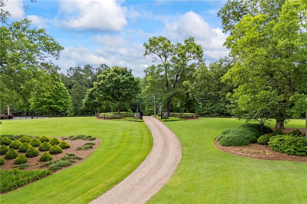 4239 Lower Jersey Road Covington, GA 30014 - Photo 23 of 91 a view of a golf course with a garden