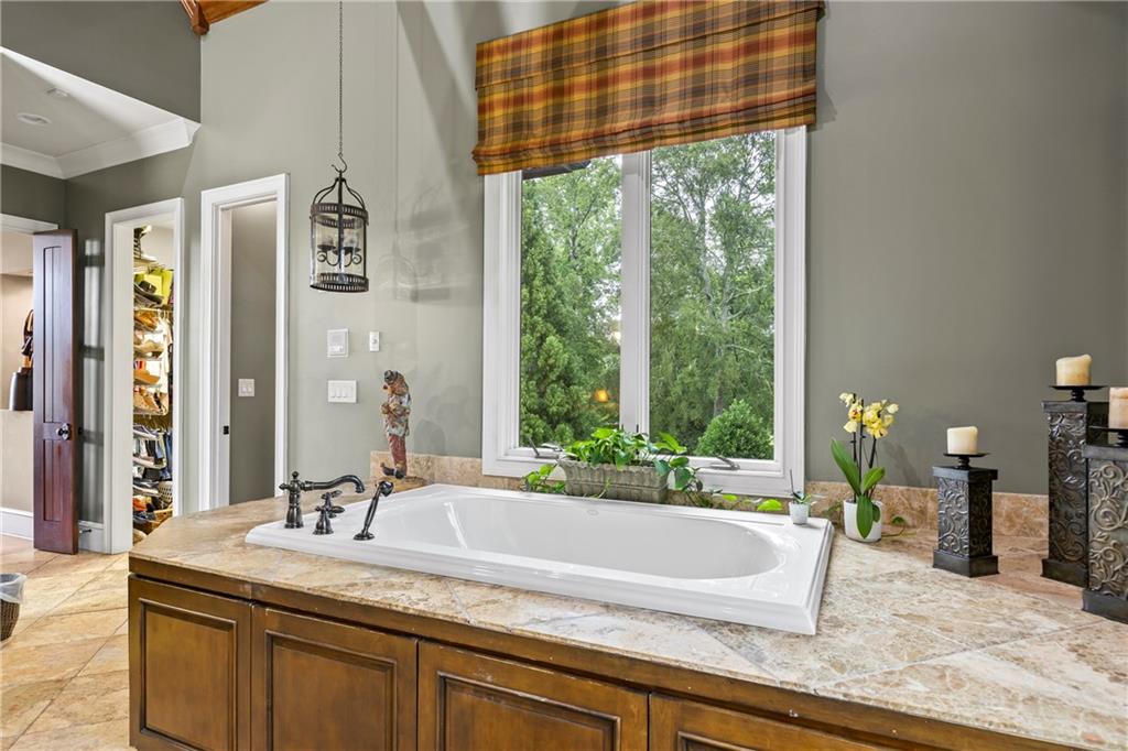 4239 Lower Jersey Road Covington, GA 30014 - Photo 44 of 91 a bathroom with a granite countertop sink and a large mirror
