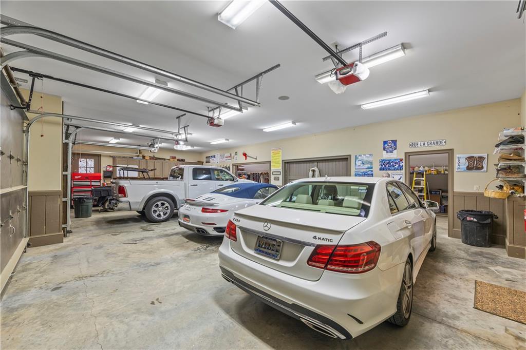 4239 Lower Jersey Road Covington, GA 30014 - Photo 57 of 91 a view of a garage with a car and parked car