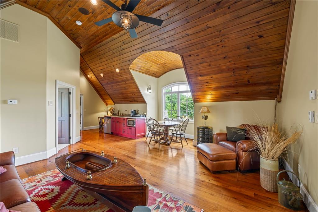 4239 Lower Jersey Road Covington, GA 30014 - Photo 65 of 91 a living room with furniture and wooden floor