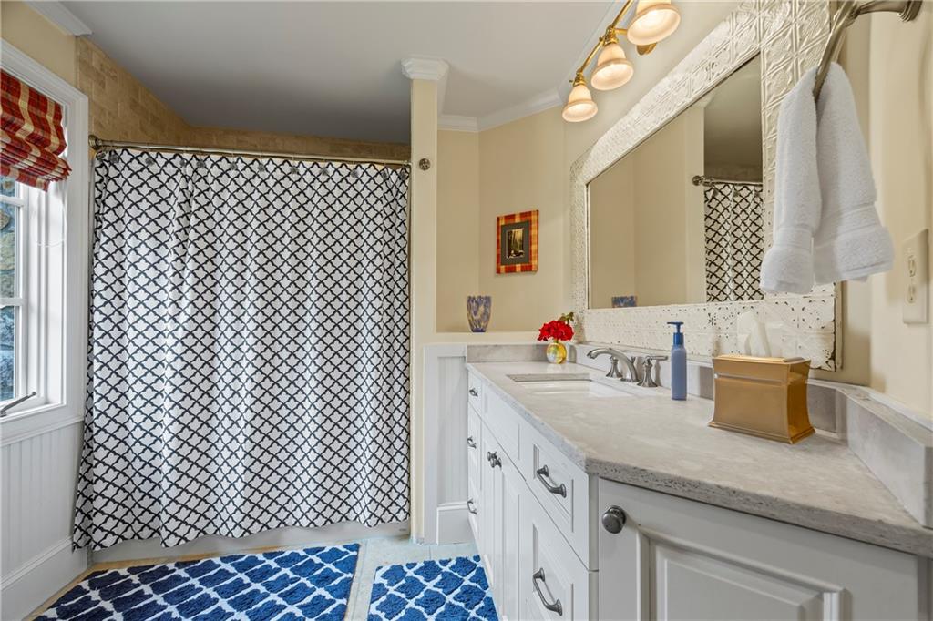 4239 Lower Jersey Road Covington, GA 30014 - Photo 68 of 91 a bathroom with a sink a vanity and a mirror
