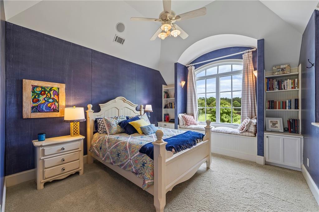 4239 Lower Jersey Road Covington, GA 30014 - Photo 69 of 91 a bed room with a bed and a chair