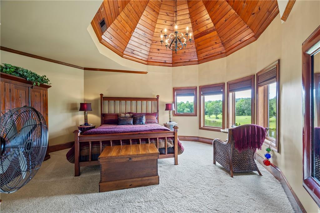 4239 Lower Jersey Road Covington, GA 30014 - Photo 70 of 91 a living room with furniture a flat screen tv and a large window