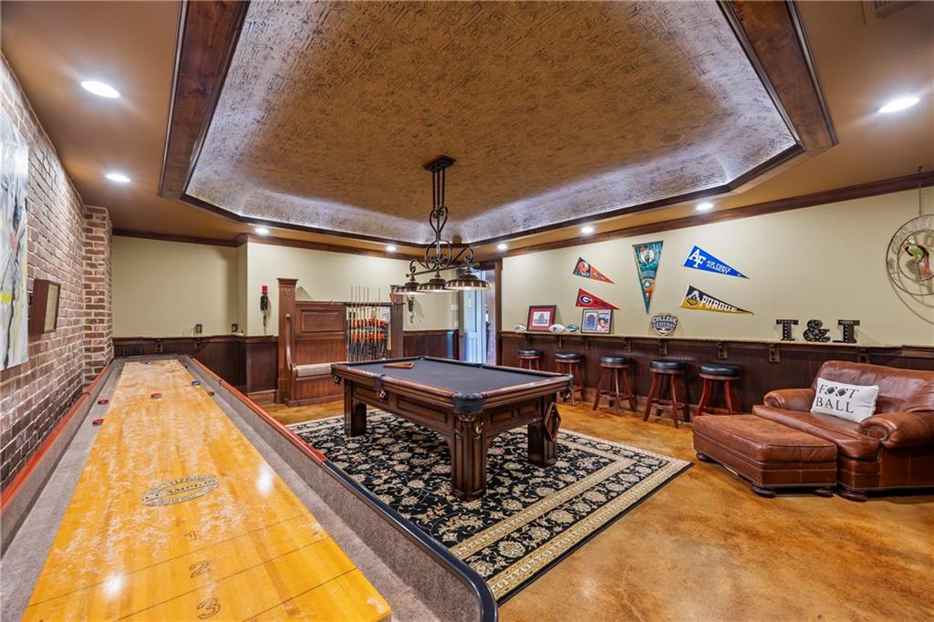 4239 Lower Jersey Road Covington, GA 30014 - Photo 79 of 91 a living room with furniture a flat screen tv and a fireplace