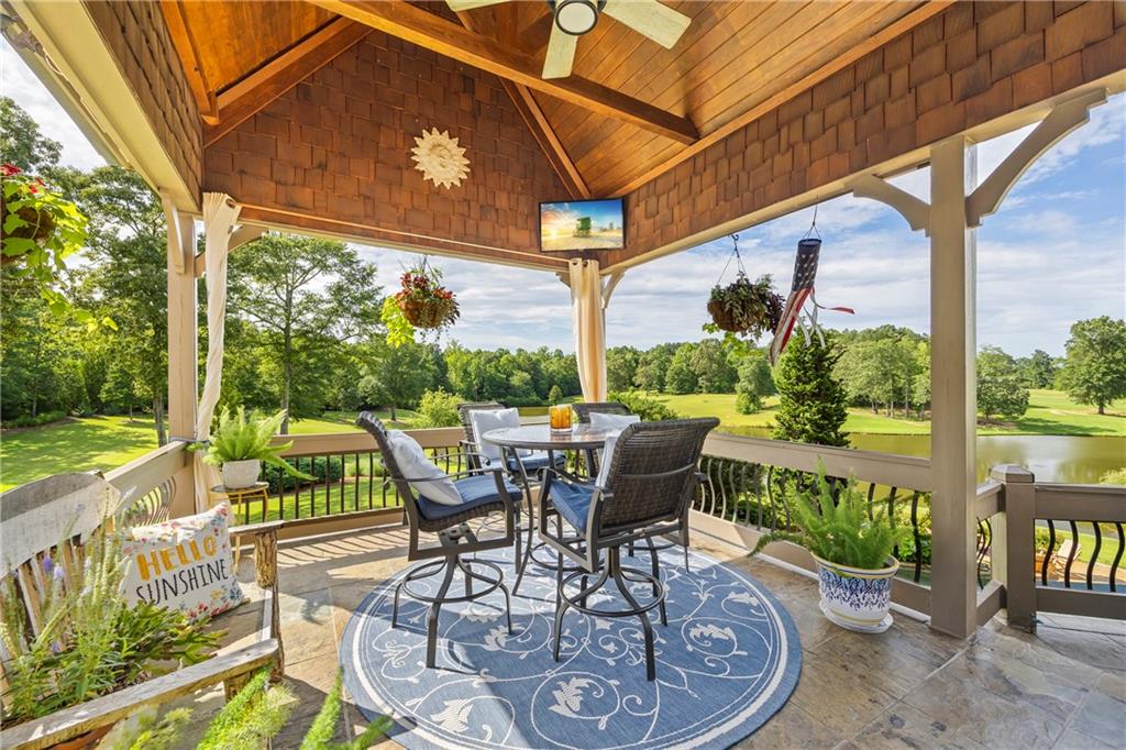 4239 Lower Jersey Road Covington, GA 30014 - Photo 85 of 91 a view of a patio with a table chairs and a table