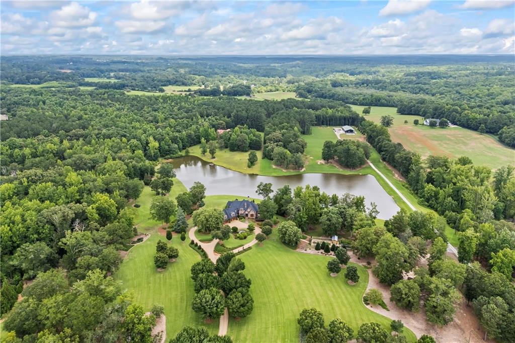 4239 Lower Jersey Road Covington, GA 30014 - Photo 9 of 91 an aerial view of residential houses with outdoor space and street view