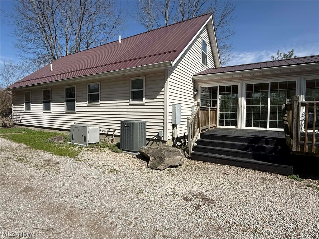 7170 Old Town Road Mount Perry, OH 43760 - Photo 2 of 41 Back of property with a metal roof and a wooden deck