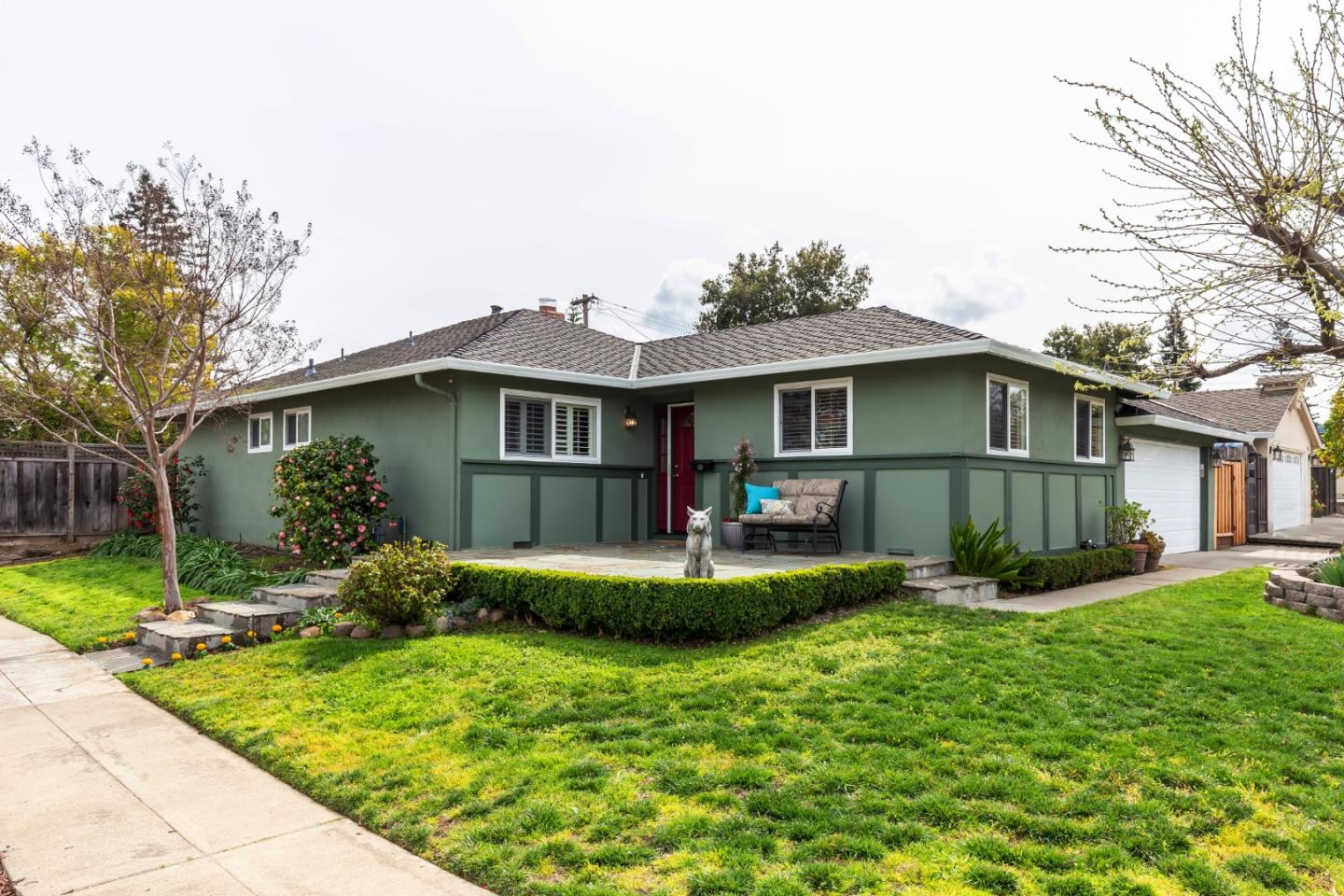 a front view of house with yard and green space