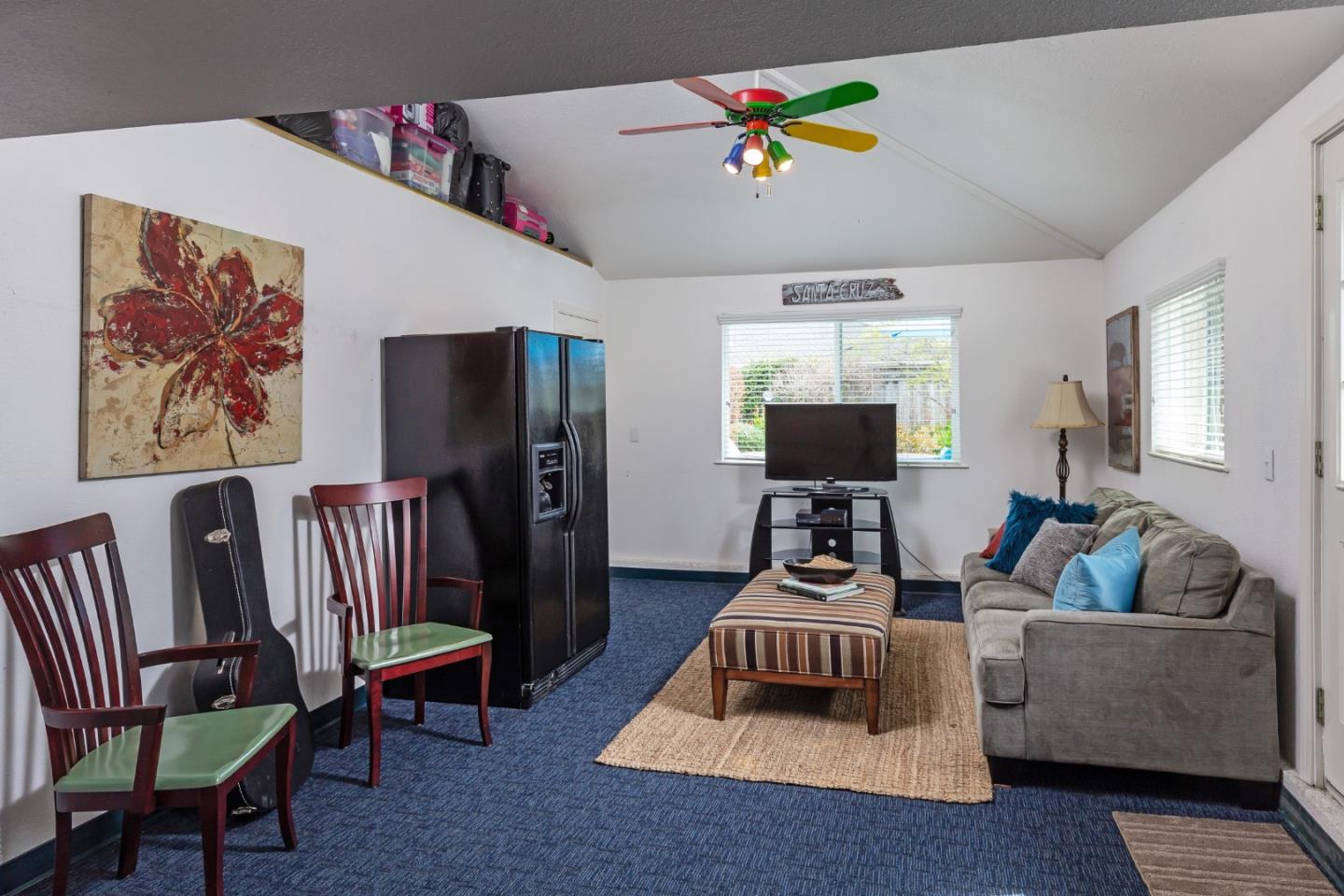 180 Maricopa Drive Los Gatos, CA 95032 - Photo 12 of 14 a living room with furniture and a flat screen tv