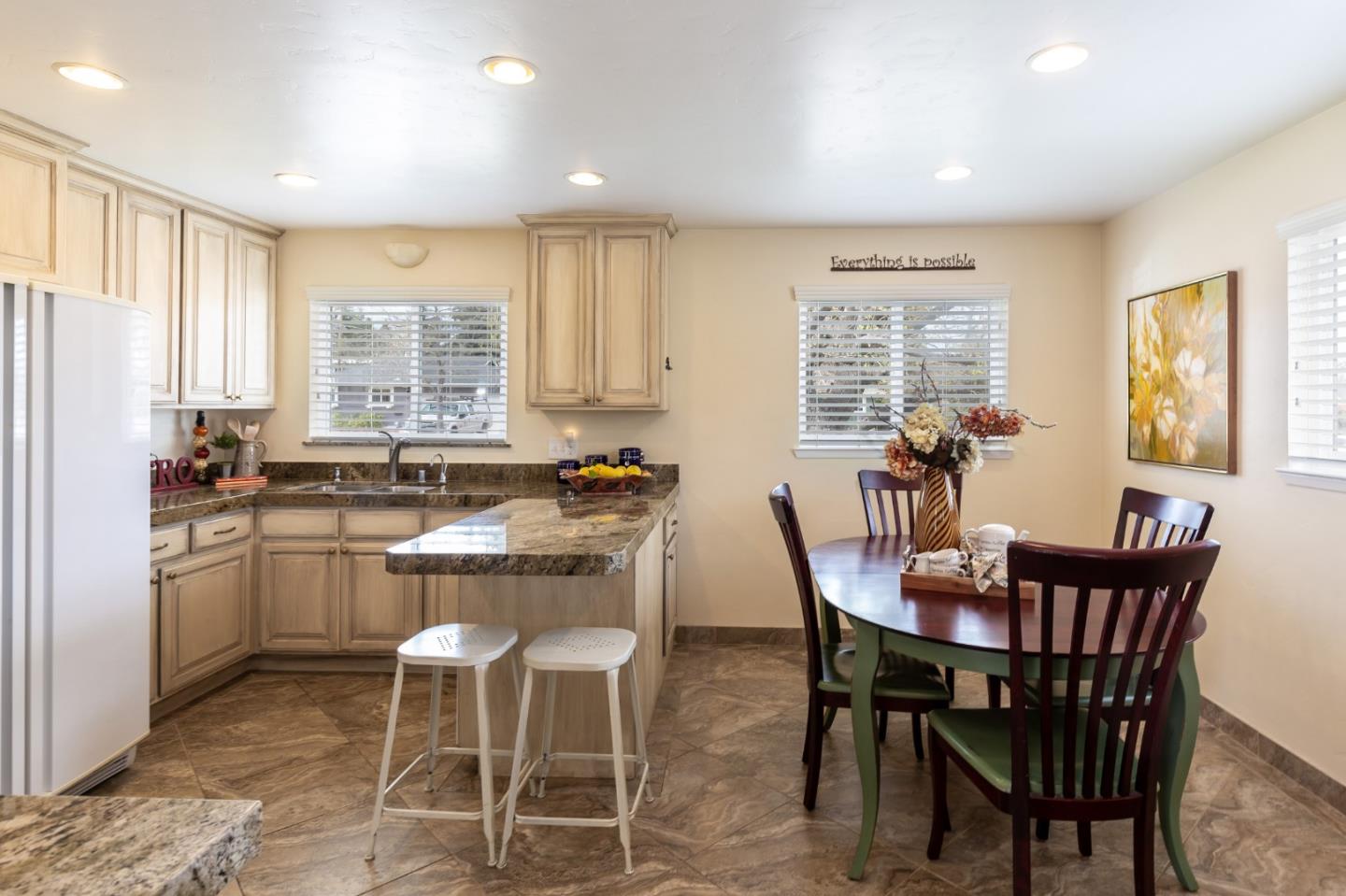 180 Maricopa Drive Los Gatos, CA 95032 - Photo 3 of 14 a dining room with a granite countertop dining table chairs and kitchen view