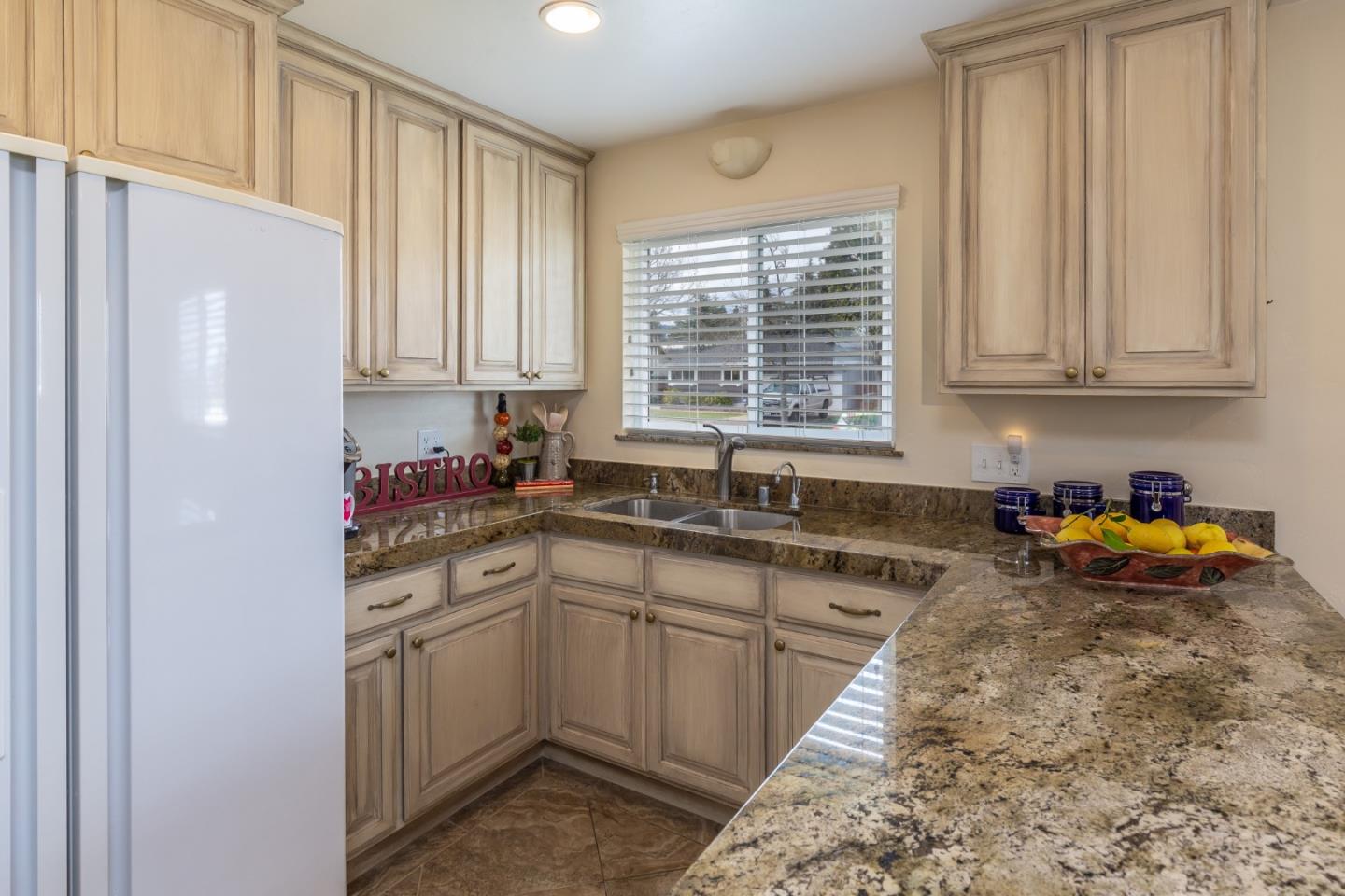 180 Maricopa Drive Los Gatos, CA 95032 - Photo 4 of 14 a kitchen with a sink stove and cabinets